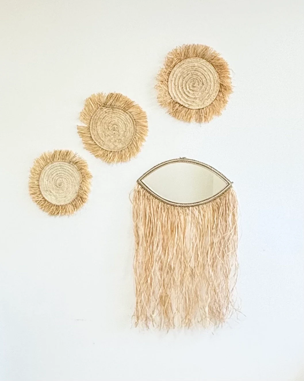 Miroir œil à franges en rotin